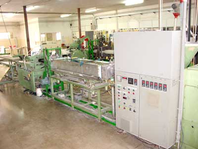 màquina amb cnc per a la fabricació de barres de plàstics tècnics semielaborats
